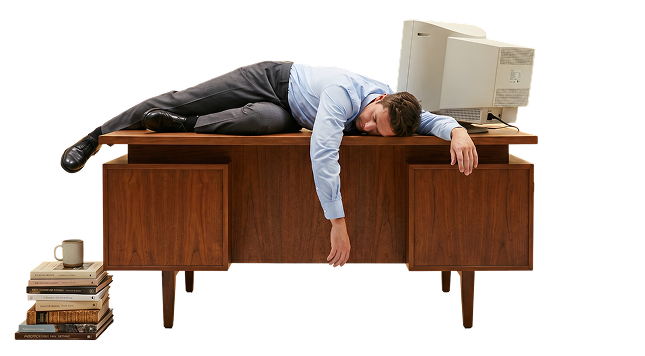 Designer collapsed face-down on a wooden desk in front of an old CRT monitor — overwork in traditional studios